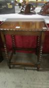 A nice oak barley twist leg occasional table with pie crust edge.