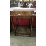 A nice oak barley twist leg occasional table with pie crust edge.