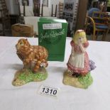 Two Royal Doulton John Beswick figures being Alice in Wonderland and The Cheshire cat.