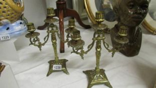 A pair of brass candelabra.