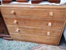 An oak 4 drawer chest.