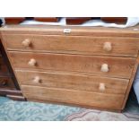 An oak 4 drawer chest.