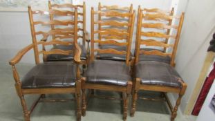 A set of 6 good quality oak ladder back chairs comprising 2 carvers and 4 diners.