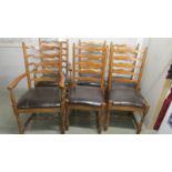 A set of 6 good quality oak ladder back chairs comprising 2 carvers and 4 diners.
