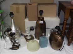 An assortment of table and wall lights/shades etc.