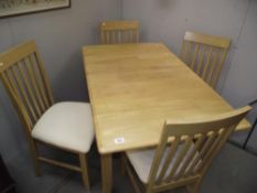 A kitchen table and 4 chairs