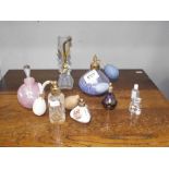 A selection of perfume bottles and atomizers