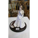 A Royal Worcester figurine 'Her Royal Highness, Princess Margaret in her Coronation Robes',