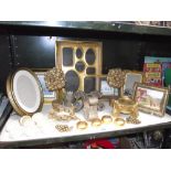 A selection of gilded gold painted picture frames, napkin rings etc.