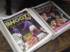 A quantity of Shoot football magazines.