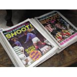 A quantity of Shoot football magazines.