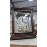 A rhythm Westminster battery bracket mahogany cased mantle clock