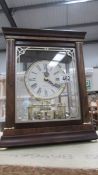 A rhythm Westminster battery bracket mahogany cased mantle clock