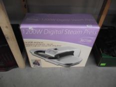 A new in box digital steam clothes press