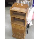 A solid pine cupboard back shelf unit