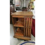 A mahogany revolving book case.