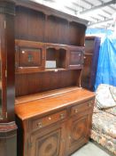 An oak open rack dresser.