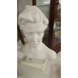 A ceramic bust of a lady.