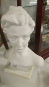 A ceramic bust of a lady.