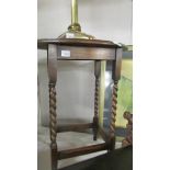 An oval oak barley twist leg occasional table.