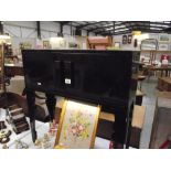 A black lacquered hall cupboard