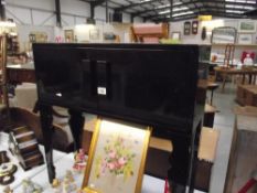 A black lacquered hall cupboard