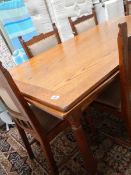 A good oak dining table and 4 chairs.