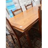 A good oak dining table and 4 chairs.