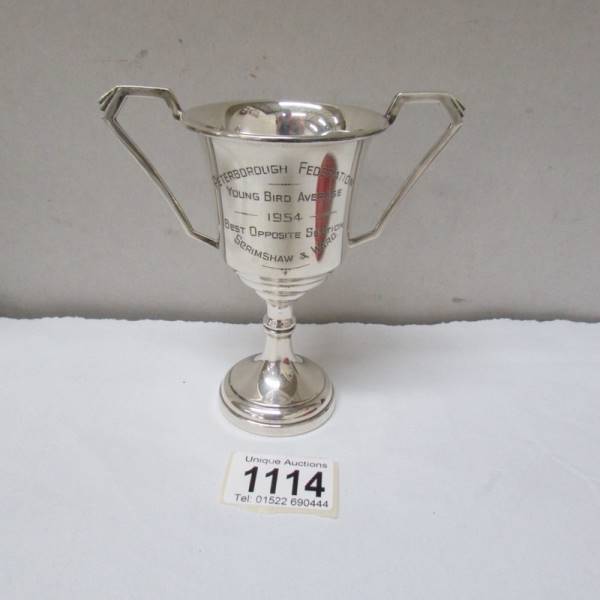 A silver trophy, 93.3 grams.