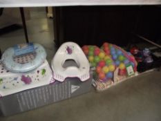 A baby travel cot ball pool,