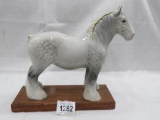 A Beswick grey shirehorse.