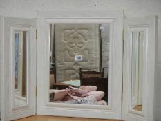 A triple dressing table mirror.