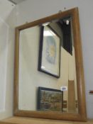 A pine framed bevel edge mirror