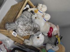 A quantity of stuffed toys including Andrex puppies in wicker basket