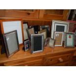 A mixed lot of picture frames including silver plate.