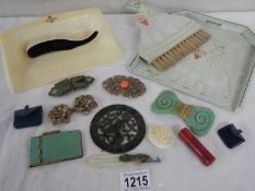 A mixed lot of vintage brooches, buckles, crumb tray with brush, miniature bags etc.