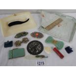 A mixed lot of vintage brooches, buckles, crumb tray with brush, miniature bags etc.