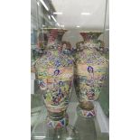 A pair of hand painted Chinese vases, 46 cm tall.