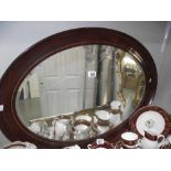 A large oval bevel edge mirror