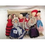 A quantity of vintage costume dolls