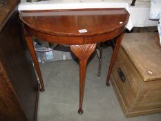 A 'D' shaped hall table on Queen Anne style legs.