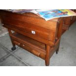 An oak tea trolley with drawer in good clean condition.