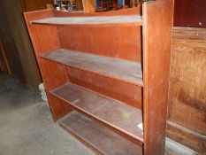 A mahogany veneered 4 shelf open book case.