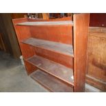 A mahogany veneered 4 shelf open book case.