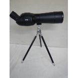 An Optus zoom 20 x 60 x 60 spotting scope with table tripod.