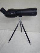 An Optus zoom 20 x 60 x 60 spotting scope with table tripod.