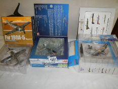 3 boxed fighting military aircraft.