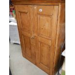 An old pine 2 door cabinet.