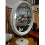 A white painted table mirror.