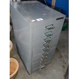 A small 10 drawer metal cabinet.